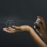 10245660-woman-applying-perfume-on-her-hand